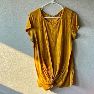 Mustard colored tee shirt, maternity style